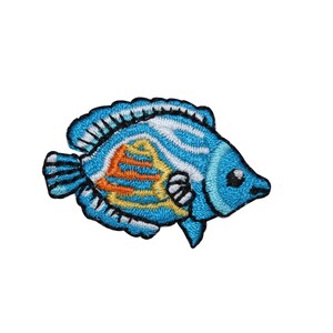 May include: A blue and yellow embroidered iron-on patch of a cartoon fish with white stripes and orange accents.