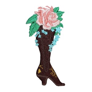 May include: Embroidered patch of a brown high-heeled shoe with a pink rose and green leaves on top.