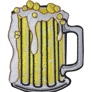 May include: An embroidered patch depicting a beer mug with a white and yellow design. The mug is filled with a yellow liquid and has foam on top.
