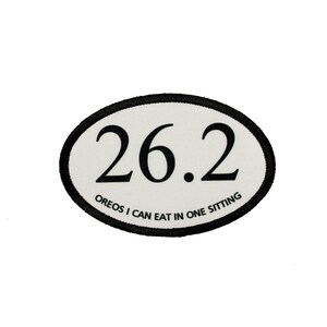 May include: White oval patch with black border and text. The text reads "26.2 OREOS I CAN EAT IN ONE SITTING".