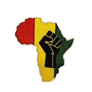 May include: An embroidered patch in the shape of the continent of Africa. The patch is red, yellow, and green, with a black raised fist in the center.