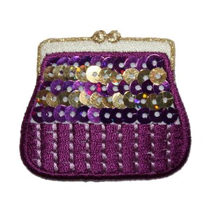 May include: A purple fabric purse with a gold clasp and sequins. The purse is decorated with gold and purple sequins.