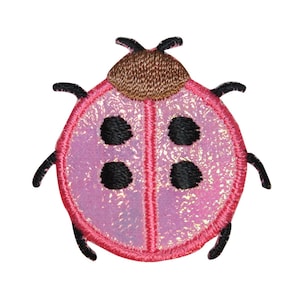 May include: Embroidered ladybird patch with a pink, iridescent body and black spots. The ladybird has a brown head and black antennae and legs. The patch is outlined in red thread.