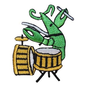 May include: A green cartoon lobster playing a drum set with a drumstick in its right claw. The drum set has a yellow and black striped bass drum and a yellow and black striped snare drum.