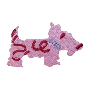 May include: Pink embroidered patch in the shape of a dog. The patch features dark red embroidered details, including the word "love" and accents on the tail and face. A light purple collar is also embroidered.