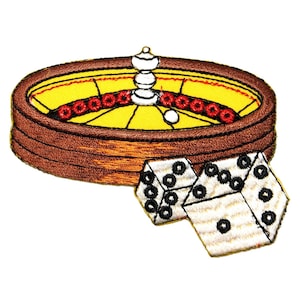 May include: A brown and yellow roulette wheel with a white ball and two white dice with black dots. The dice are lying on the table next to the roulette wheel.