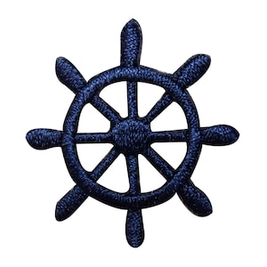 May include: A dark blue embroidered nautical wheel with eight spokes. The wheel is a popular symbol of the sea and is often used in nautical decor.