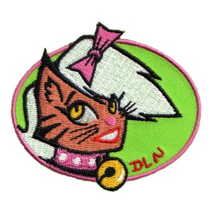 May include: An embroidered patch featuring a cartoon cat with a pink bow, a white hat, and a pink collar with a bell. The cat has orange fur, black eyes, and a pink nose. The background is green and the text "DLA" is embroidered in pink.