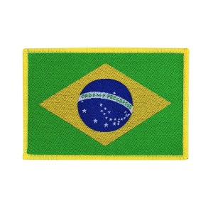 May include: A green, yellow, and blue embroidered patch featuring the flag of Brazil. The flag has a blue circle with white stars and the text "Ordem e Progresso" in the center. The patch is surrounded by a yellow border.