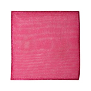May include: A pink fabric patch with a pink stitched border. The fabric has a subtle shimmer.