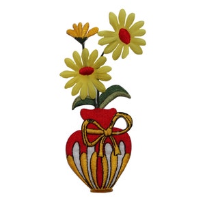 May include: A red and white striped vase with a yellow bow, holding three yellow flowers with red centers.