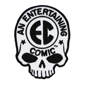 May include: Black and white embroidered patch with a skull design and the text "An Entertaining Comic" around a circle with the letters "EC" inside.