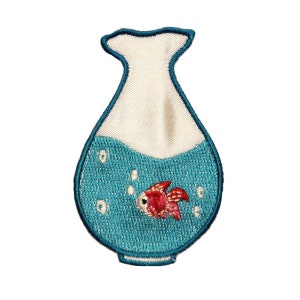 May include: A blue and white embroidered patch of a fishbowl with a red goldfish inside. The fishbowl is shaped like a vase.