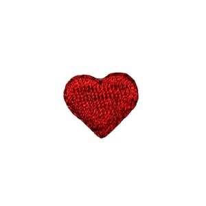 May include: A small red embroidered heart patch.