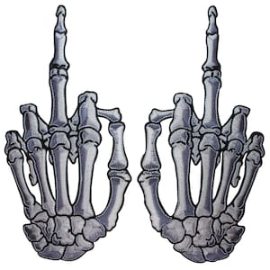 May include: Two embroidered iron-on patches of skeleton hands giving the middle finger. The patches are gray and white.