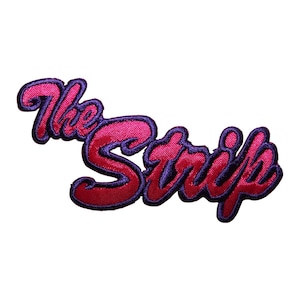 May include: Embroidered patch with the text "The Strip" in a pink and purple color scheme.