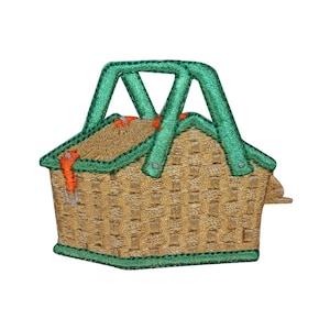 May include: A green and brown embroidered picnic basket with a handle.