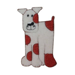 May include: White felt dog applique with red spots. The dog has a simple embroidered face with black eyes and a nose.