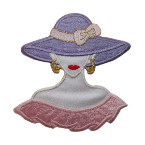 May include: Purple embroidered iron-on patch of a woman wearing a large hat with a pink bow and pink ruffled collar.