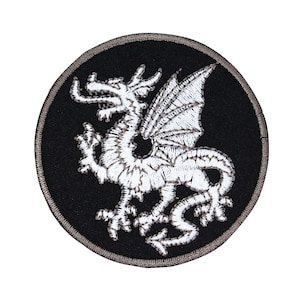 May include: White embroidered dragon patch on a black circular background with a gray border.