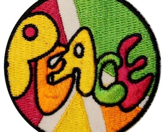 May include: A round embroidered patch with a peace sign design. The peace sign is made up of a rainbow of colors, including red, orange, yellow, green, and blue. The word "Peace" is written in a stylized font in yellow, green, and pink.