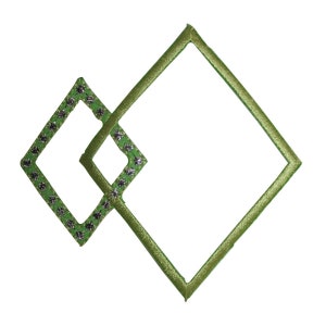 May include: Two green diamond-shaped frames with rhinestones around the edges. The smaller frame is inside the larger frame.