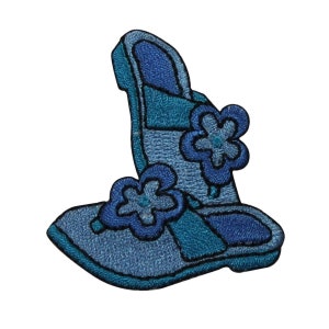 May include: A pair of blue embroidered sandals with flower embellishments.