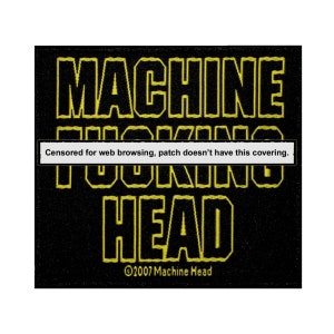 May include: Black and yellow embroidered patch with the text "MACHINE HEAD" and the copyright symbol with the year 2007 and the text "Machine Head".