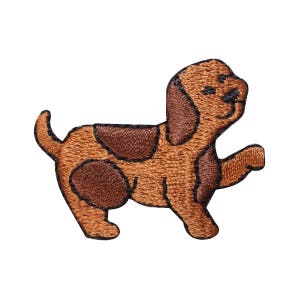 May include: A brown and white embroidered patch of a cartoon dog with a brown body and white spots. The dog is standing on all fours with its tail curled up.