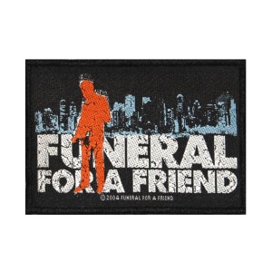 May include: Black rectangular patch featuring an orange silhouette of a person in front of a cityscape. The words "FUNERAL FOR A FRIEND" are in distressed white font. The copyright reads "© 2004 FUNERAL FOR A FRIEND".