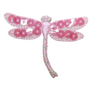 May include: Pink embroidered dragonfly with silver sequins. The dragonfly has a long, thin body and two pairs of wings.
