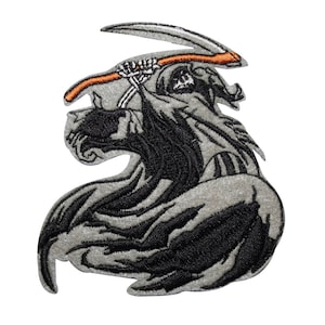 May include: Embroidered iron-on patch featuring a black and gray grim reaper holding a scythe. The reaper is wearing a hooded robe and has a skeletal face.
