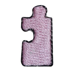 May include: A pink puzzle piece with a black outline.