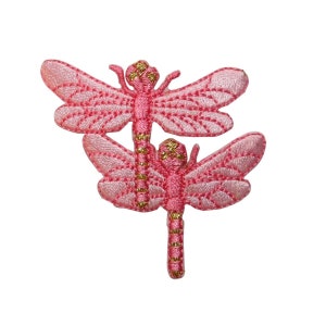 May include: Two pink embroidered dragonfly iron-on patches with gold accents.