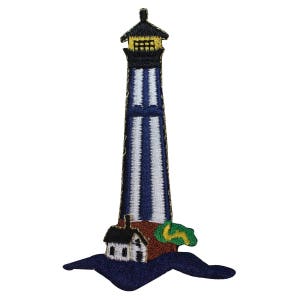 May include: An embroidered patch of a blue and white striped lighthouse with a small house at the base and a green bush. The lighthouse has a black roof and a yellow window.