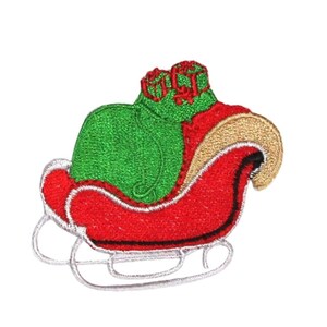 May include: Red and green embroidered Christmas stocking with a white trim. The stocking is filled with presents and is sitting on a white background.