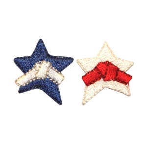 May include: Two embroidered stars, one blue with a white star in the center, and one white with a red bow in the center.