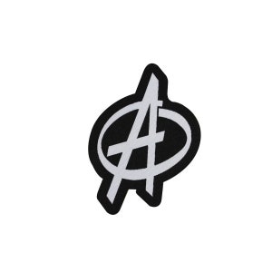 May include: A black and white embroidered patch featuring the letter "A" inside an oval. The letter and oval are white, outlined in black. The patch is likely for clothing or accessories.