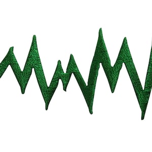 May include: A green zig-zag line, resembling a jagged edge or a mountain range, is drawn against a white background.