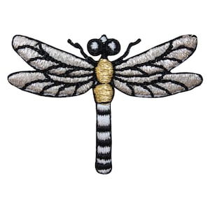 May include: A silver and black embroidered dragonfly with a gold body. The dragonfly has black and white striped legs.