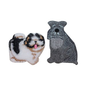 May include: Two embroidered iron-on patches of dogs. One is a white, black, and brown Shih Tzu with its tongue sticking out. The other is a gray Schnauzer.