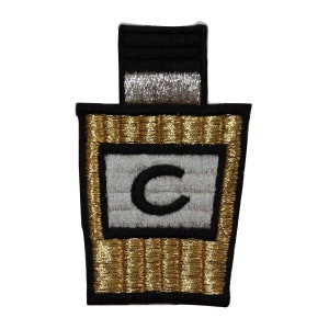 May include: Gold and black embroidered patch with a white square in the center. The square has a black letter "C" in the center.