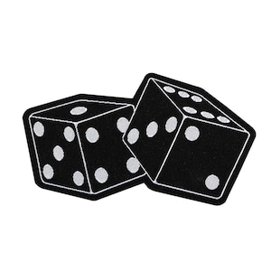 May include: Two black dice with white dots, one on top of the other. The dice are embroidered with white stitching.