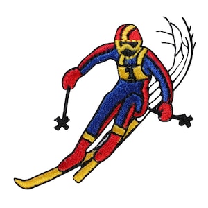 May include: An embroidered patch of a skier in a red, blue, and yellow ski suit, holding ski poles and skiing down a slope. The skier is wearing a helmet and has a number "1" on their chest.