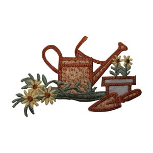 May include: Embroidered iron-on patch featuring a brown watering can, a green plant with yellow flowers, and a brown trowel. The patch is ideal for adding a touch of gardening charm to clothing, bags, or other fabric items.
