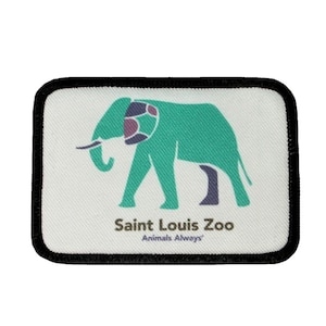 May include: A white rectangular patch with a black border. The patch features a green elephant with a purple and brown patterned ear. The text "Saint Louis Zoo" and "Animals Always" is printed below the elephant.