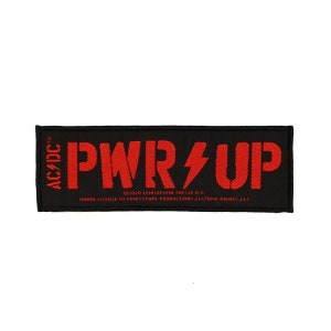 May include: Black fabric patch with red lettering that reads "PWR UP" with a lightning bolt symbol. The text "AC/DC TM" is on the left side of the patch. The text "2020 LEIDSEPLEIN PRESSE B.V. UNDER LICENSE TO PERRYSCOPE PRODUCTIONS, LLC/EPIC RIGHTS, LLC" is printed in small white letters at the bottom of the patch.