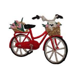 May include: Red bicycle with a basket full of flowers. The bicycle has a white bunny rabbit on the handlebars.