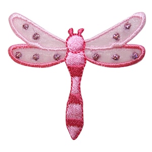 May include: Pink embroidered dragonfly applique with a glittery finish. The dragonfly has a striped body and translucent wings.