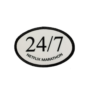 May include: White oval patch with black border and text. The text reads "24/7 NETFLIX MARATHON".